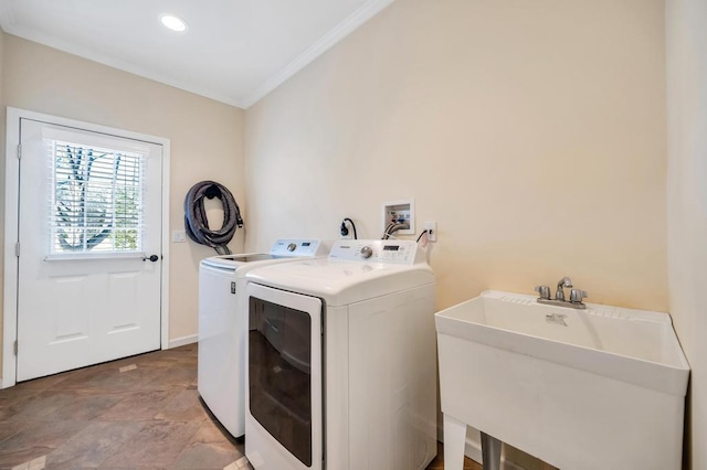 laundry area featuring laundry area, recessed lighting, ornamental molding, a sink, and washer and clothes dryer