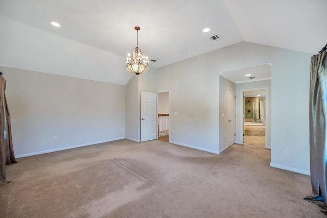 unfurnished bedroom with visible vents, carpet flooring, baseboards, and vaulted ceiling