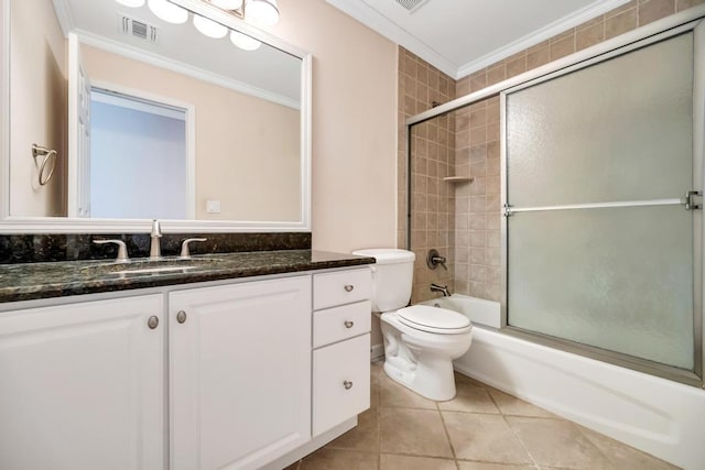 bathroom with vanity, crown molding, visible vents, and tile patterned floors