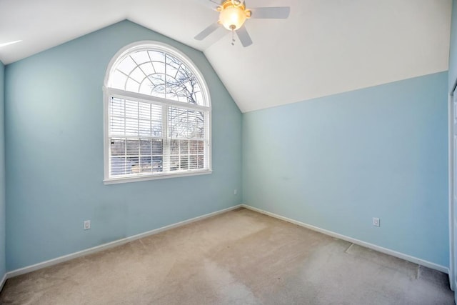 additional living space featuring baseboards, lofted ceiling, ceiling fan, and carpet flooring