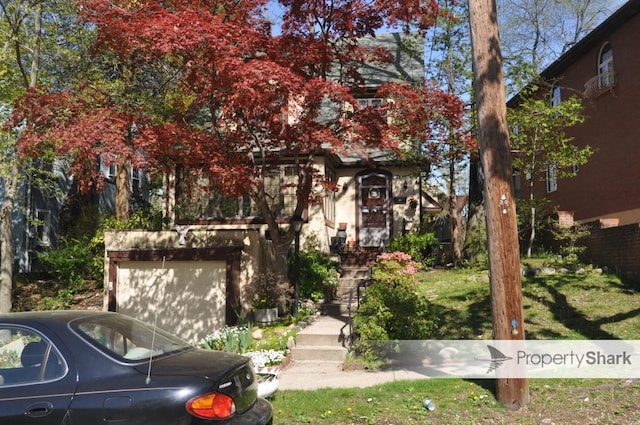 obstructed view of property featuring a garage