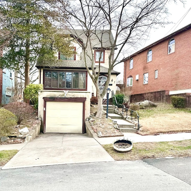 view of front of property with a garage