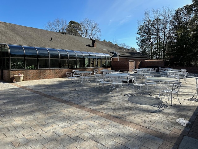 view of patio / terrace with a sunroom