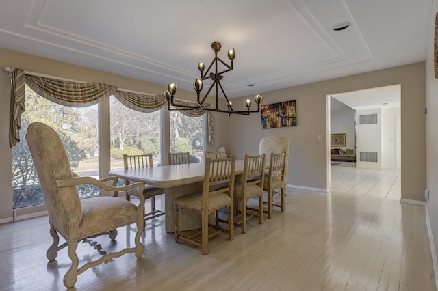 dining space with light hardwood / wood-style floors