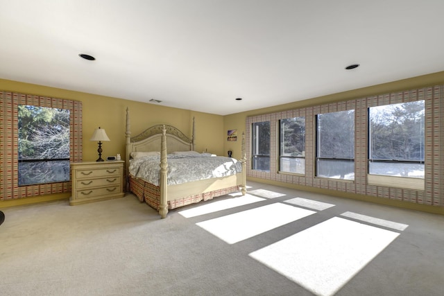 bedroom featuring carpet floors and visible vents