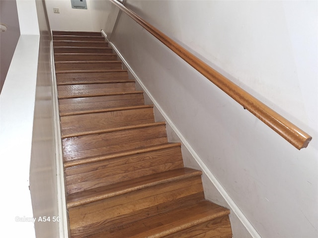 staircase featuring hardwood / wood-style floors