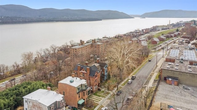 aerial view featuring a water and mountain view