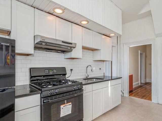 kitchen with white cabinets and black appliances