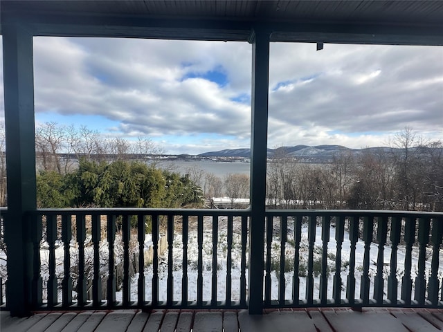 wooden deck with a mountain view