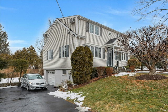 view of front of property with a garage and a front yard