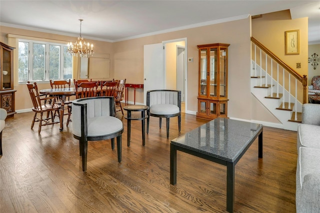 interior space featuring ornamental molding, a chandelier, and hardwood / wood-style floors