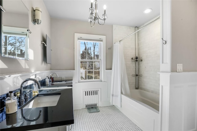 bathroom with sink, radiator heating unit, shower / bathtub combination with curtain, and tile patterned floors