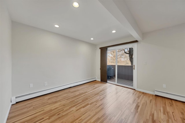 empty room featuring light hardwood / wood-style floors, baseboard heating, and beam ceiling