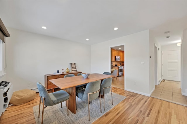 dining room featuring light hardwood / wood-style flooring