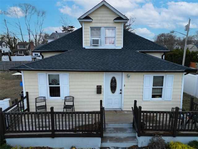 view of front of house featuring a wooden deck and cooling unit