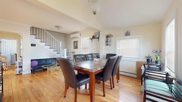 dining space featuring a baseboard radiator, a wall unit AC, light hardwood / wood-style floors, and beamed ceiling