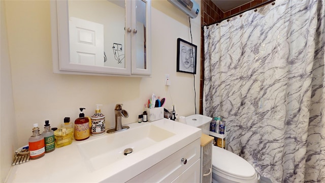 bathroom with vanity, a shower with curtain, and toilet