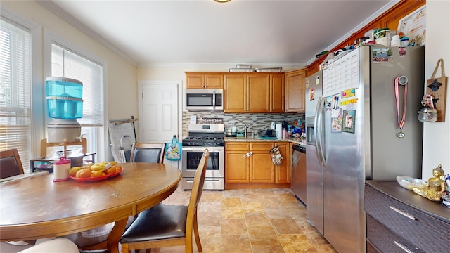 kitchen featuring ornamental molding, stainless steel appliances, light stone countertops, and backsplash