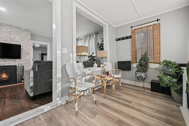 sitting room with wood-type flooring and a fireplace