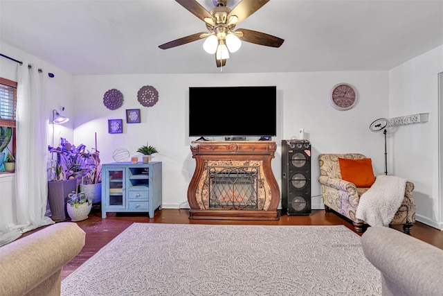 living room with ceiling fan and dark hardwood / wood-style flooring