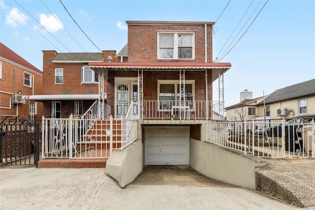 view of front of house with a garage and covered porch