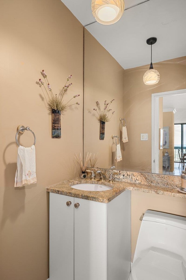 bathroom with vanity and toilet