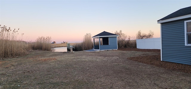 view of yard at dusk