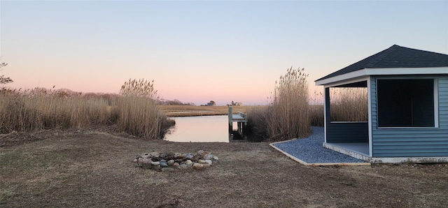 view of yard at dusk