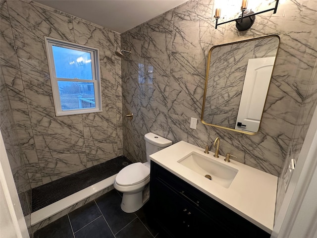 bathroom featuring vanity, tiled shower, tile walls, and toilet