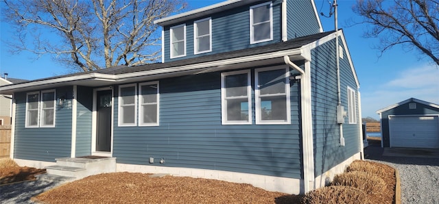 view of front of property featuring an outbuilding and a garage