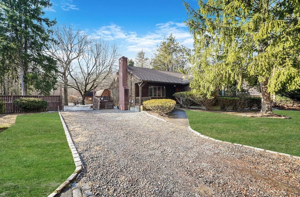 view of side of property featuring a yard