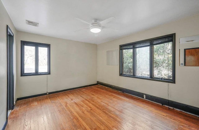 unfurnished room featuring ceiling fan and light hardwood / wood-style flooring