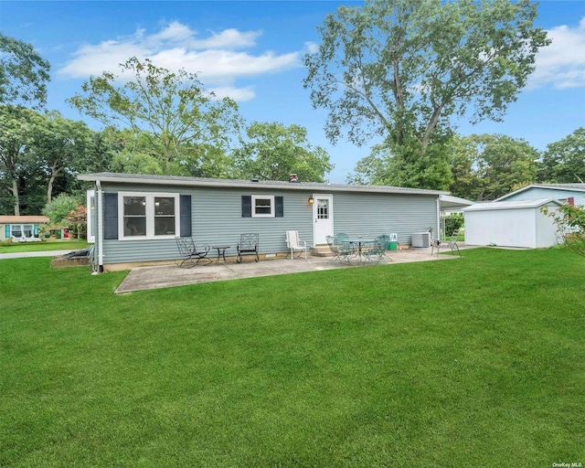 back of house with a yard, a patio, and central air condition unit