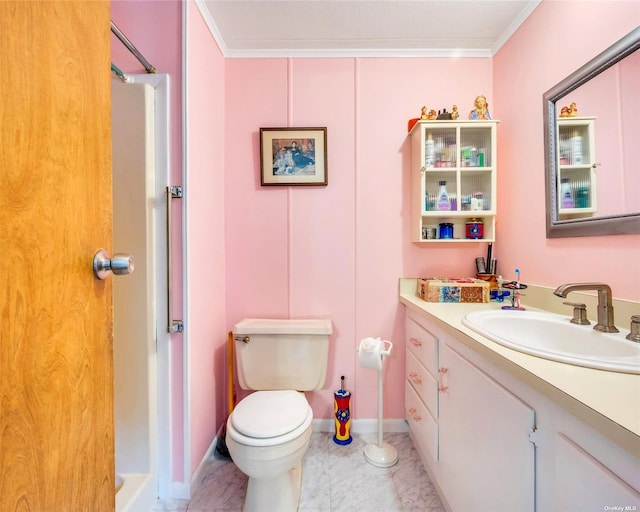 bathroom with crown molding, vanity, toilet, and a shower