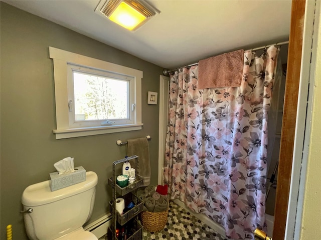 bathroom with a baseboard heating unit, a shower with curtain, and toilet