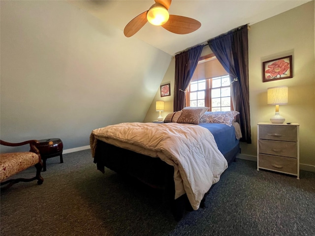 carpeted bedroom featuring ceiling fan and lofted ceiling