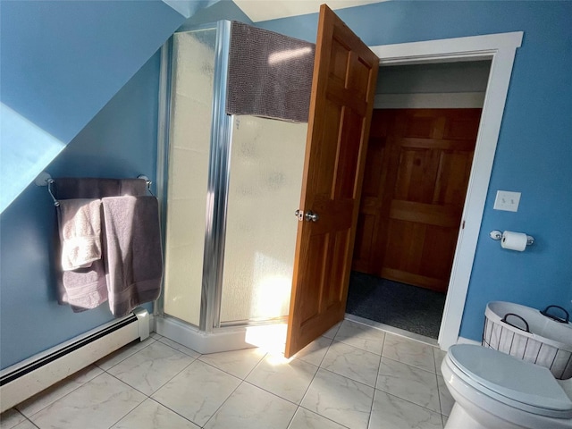 bathroom featuring baseboard heating, toilet, and an enclosed shower