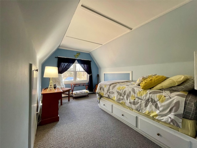 bedroom featuring vaulted ceiling and carpet floors