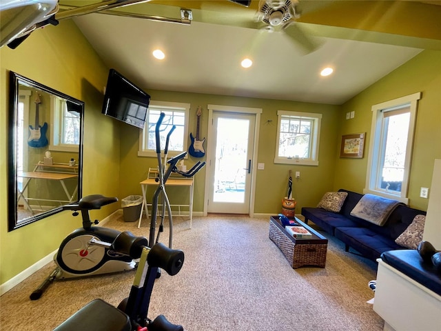 exercise area with lofted ceiling, a wealth of natural light, ceiling fan, and carpet