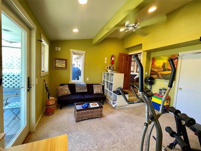 interior space featuring carpet, vaulted ceiling with beams, and ceiling fan