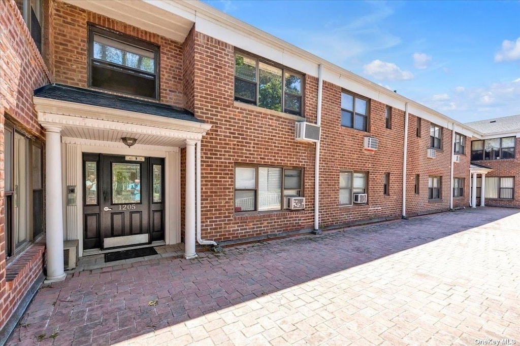 1205 E Broadway Unit F-13, Hewlett, NY 11557 - exterior space with cooling unit and a wall mounted AC