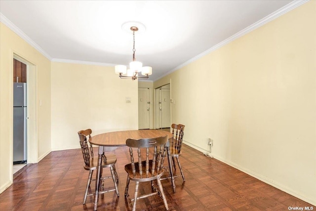 dining room featuring dark parquet flooring, crown molding, and a chandelier