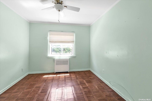 spare room featuring ornamental molding, radiator heating unit, and ceiling fan