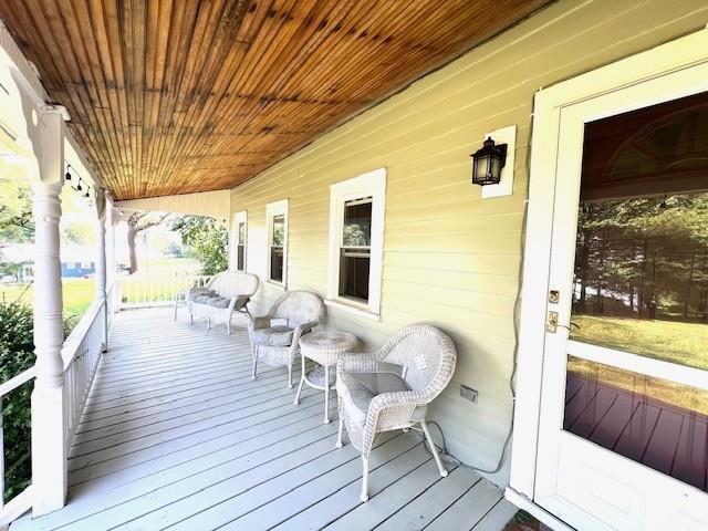 wooden deck featuring a porch