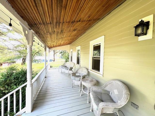 wooden deck featuring covered porch