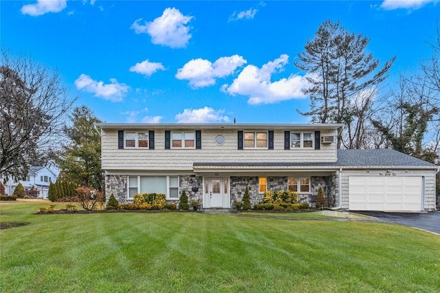 view of front of home with a garage and a front yard