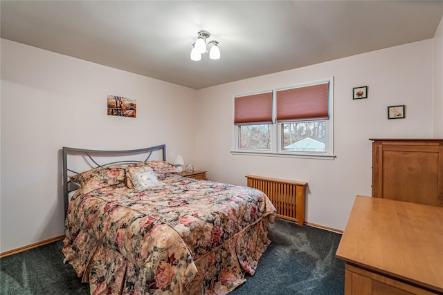 carpeted bedroom with radiator heating unit