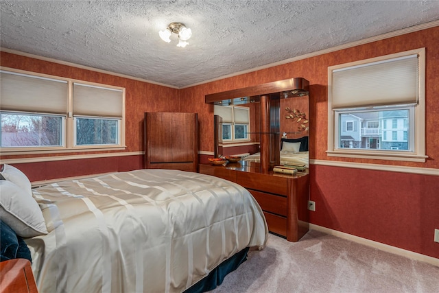 carpeted bedroom featuring ornamental molding and a textured ceiling