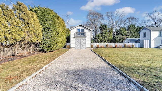 exterior space with a shed and a front yard