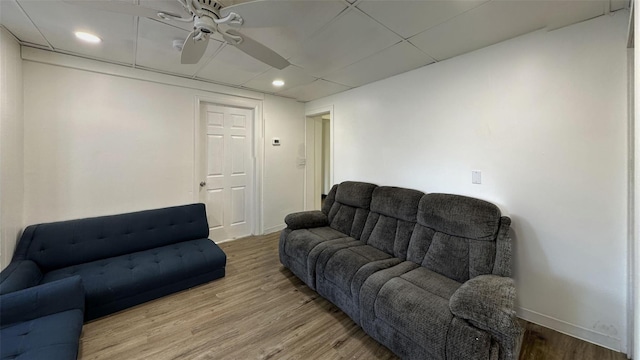 living room with hardwood / wood-style floors and ceiling fan